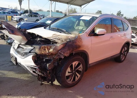 2016 Honda Cr-V Touring z USA, uszkodzony, nr VIN 5J6RM4H93GL109044